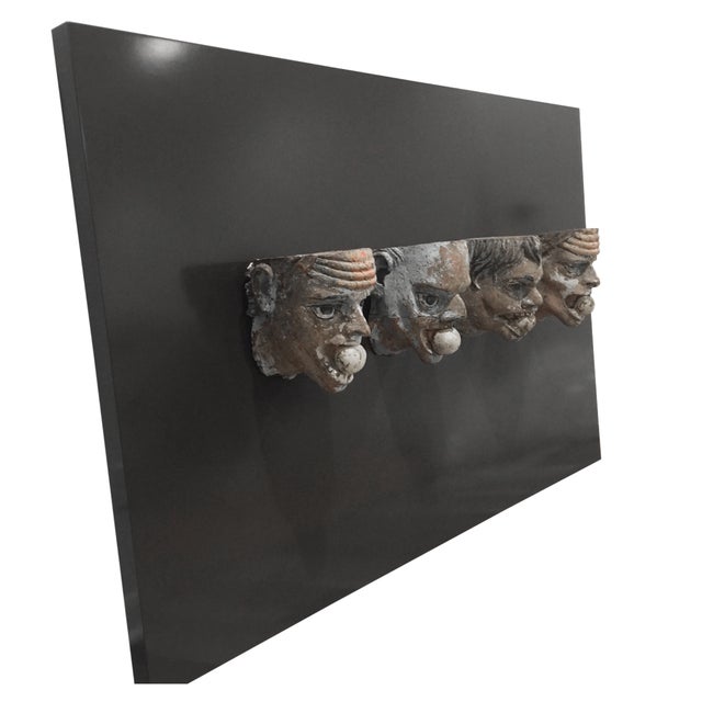 Presenting a remarkably rare and captivating architectural find: an intact, matching set of four antique hand-carved...