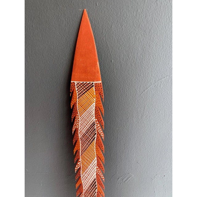 Title: A ceremonial spear with clan design paint Artist: Patrick Freddy Puruntatameri DOB: 19/04/1973 Medium: Ocher paint...