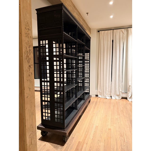 This stunning two-way shelving unit in black steel is from the library and archives of the Pennsylvania State House from...