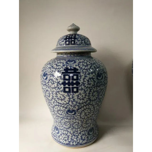 This 20" tall blue and white jar is hand-made and hand-painted with traditional blue and white motif by ceramist from...