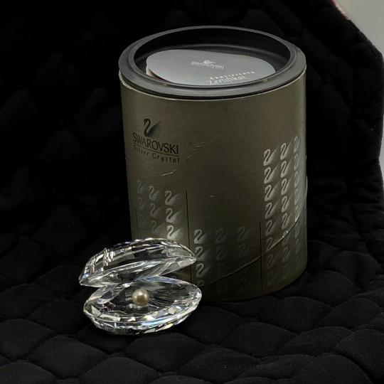 The Swarovski Crystal Oyster Shell with Pearl was introduced in 1988 as part of the "Aquatic Worlds" collection and was...
