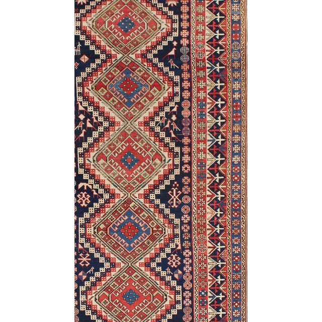 Measures: 3'11 x 7'1. Multicolored antique Caucasian Shirvan rug with tribal design and medallions. Keivan Woven Arts /...