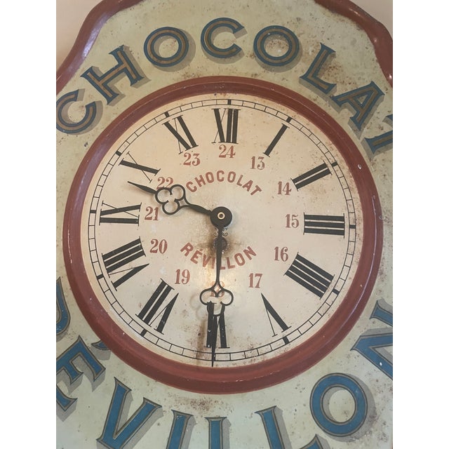 A unique clock that hung throughout the café and was used as an advertising sign for the Chocolat Révillon brand. This was...
