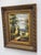 Design Plus Gallery presents a Signed Painting on Canvas in a Giltwood Frame. The frame is thick with intricate details....