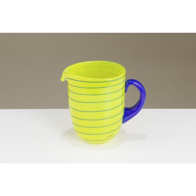 A vintage glass pitcher designed by Anna Ehrner for Kosta Boda, Sweden. Part of the "Epoque" collection introduced in the...