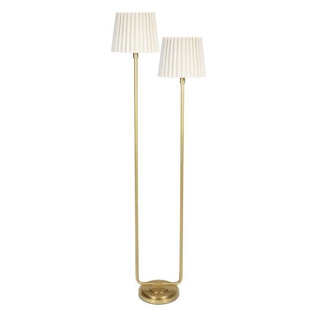 The Polly Floor Lamp exudes timeless elegance with its two signature pleated shades, casting a soft, comforting glow that...