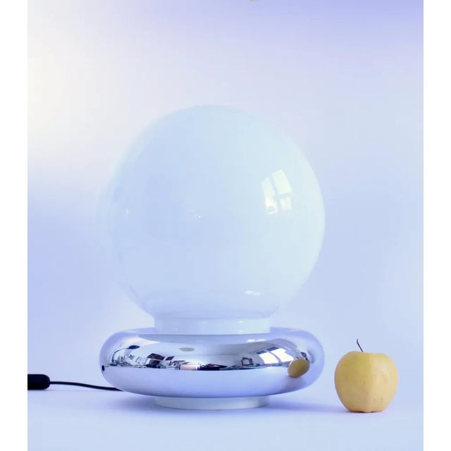 1970s stunning Space age glass lamp desk/table lamp. Opaline glass with a long neck inserted in a steel chromed ring all...
