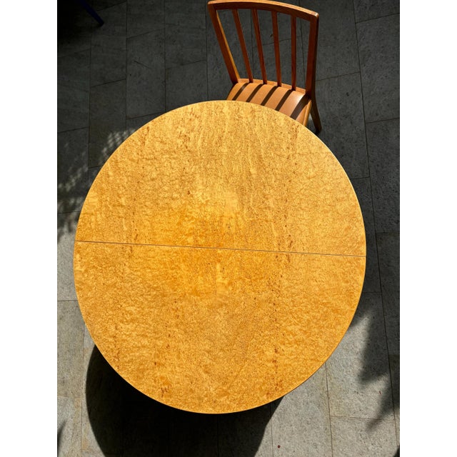 Round wooden extendable table, Sweden, 1960s. Birch wood table. The table has two additional tabletop elements and the...
