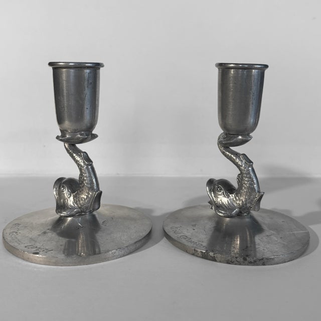 A pair of decorative Art Deco pewter candlesticks made in Sweden in 1931 by an unidentified manufacturer. Each candlestick...
