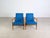 Two beautiful and extremely rare vintage armchairs from the 1950s for sale. The cushions feature a modern dark blue cover...