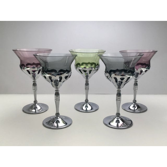 A beautiful collection of chrome stemmed glasses in a trio of complimentary colors, ideal for adding a unique note to your...
