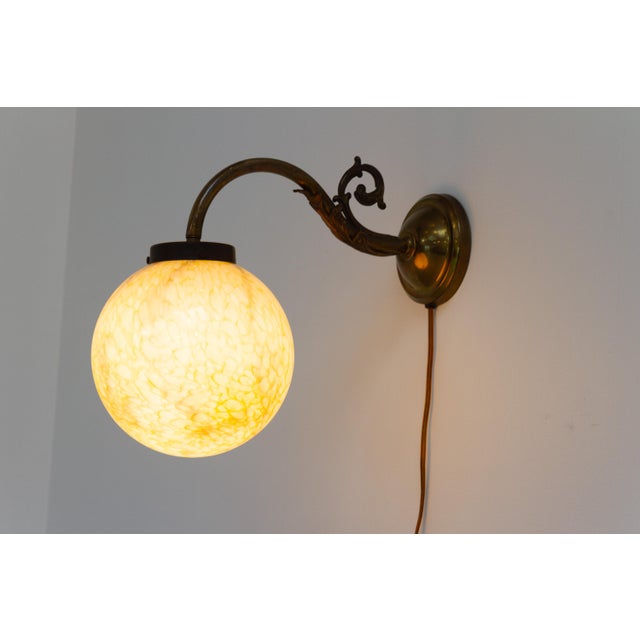 Italian Art Nouveau Glass and Brass Moon Wall Light, 1920s. Wonderful Italian wall sconce dating from the 1920s. Designed...
