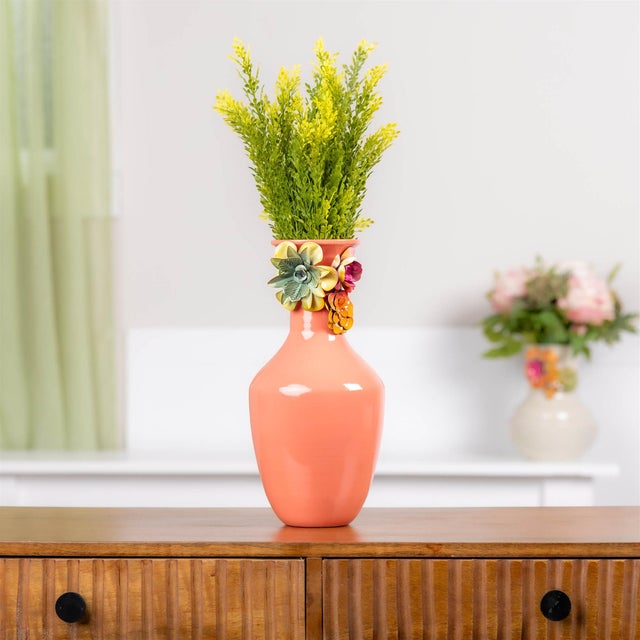 Bring sculptural beauty and garden-inspired charm into your home with this Embossed Floral Iron Vase. Featuring...