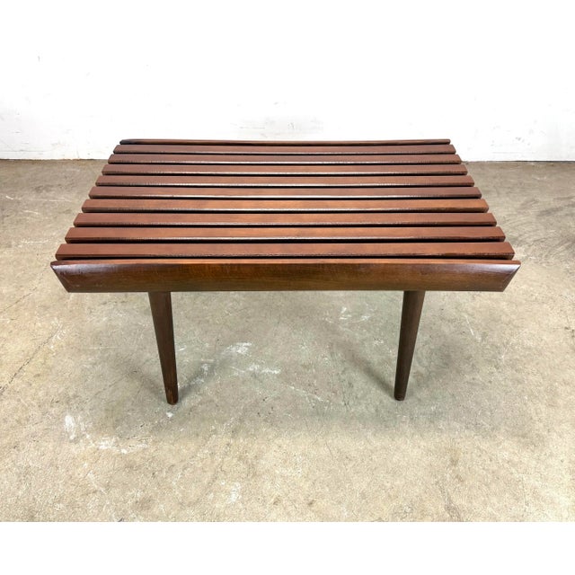 A classic mid century modern hardwood short slat bench, made in former Yugoslavia circa 1960’s. Professionally and...