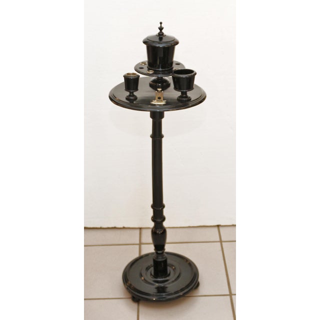 Art Nouveau smoking table, circa 1900. Base resting on three spheres, turned column. Tabletop with wooden boxes for...