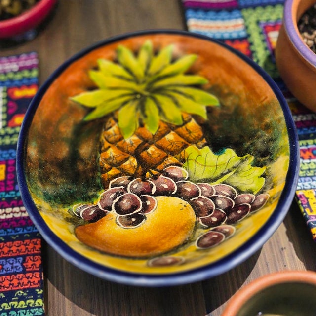 This vintage hand-painted tropical fruit majolica oval wall plate from Santa Rosa, Mexico is a unique and handmade piece...