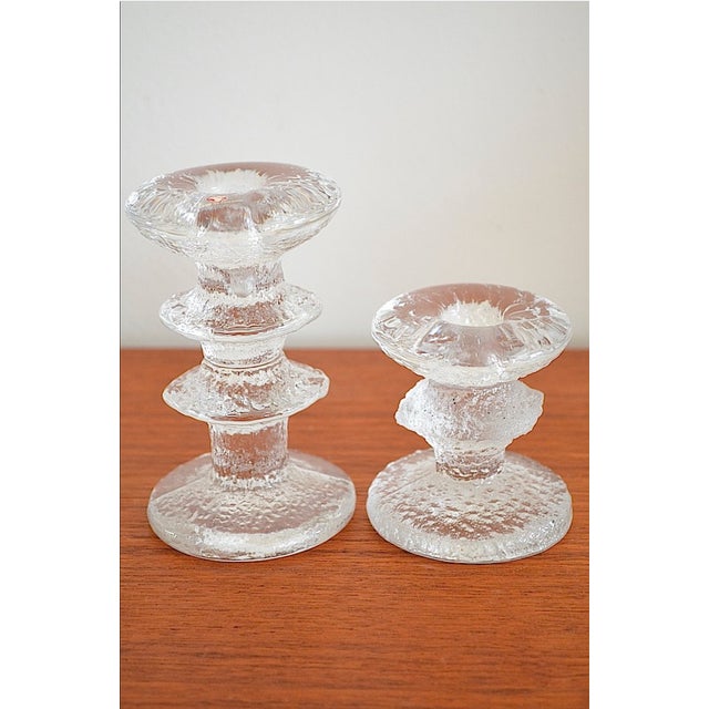 Glass candlesticks, set of 2, by Timo Sarpaneva for Iitalla. Some are marked Iitalla or TS. Height 12.2 cm, height 7.6 cm...