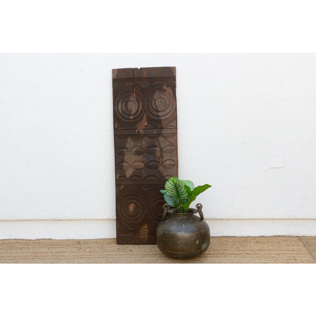 This 54-inch door is a single-slab Igbo piece from Anambra State, southeastern Nigeria, carved from one solid monolithic...