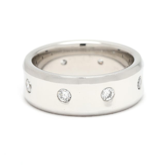 Stones: diamonds, 8 stones round brilliant cut 2.25 mm approximately .32 total carats F-G color, VS1-2 clarity Ring Size:...