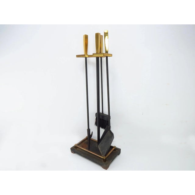 Vintage Art Deco inspired brass and iron 4-piece fireplace tool set. The handles are solid polished brass. Tool size:...