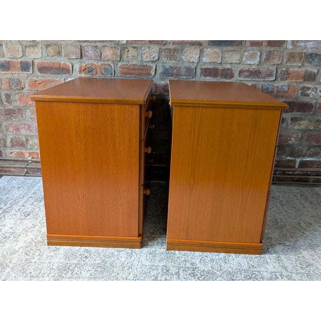 A perfectly matched pair of mid-century modern "Albany" chests of drawers manufactured by the renowned British firm Stag...