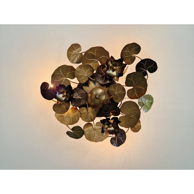 Brass ceiling/wall light with water lily leaf design, Hollywood Regency style, 1970s-80s. French craftsmanship in the...