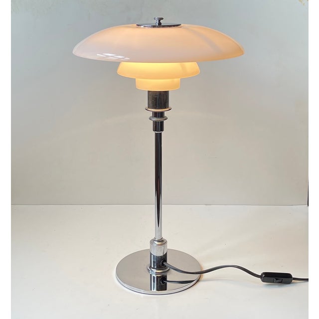Based upon a design from the late 1920s this ph 3/2 desk lamp was relaunched by louis poulsen in denmark in 1999. This...