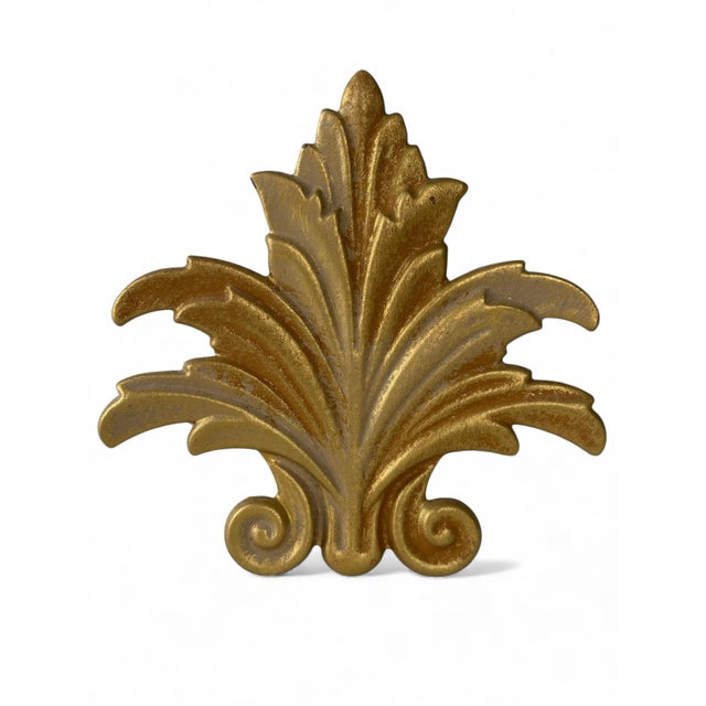 These vintage gilt cast iron and steel acanthus tiebacks offer a sculptural accent with classic Hollywood Regency and...