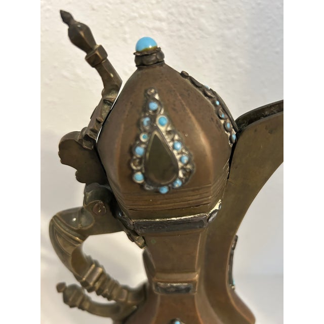 Height: 12 ¾ in (32.5 cm) Material: Brass with silver appliqué and turquoise cabochons Origin: Azerbaijan (likely Baku or...