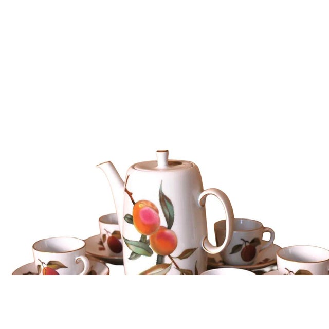 Exquisite Royal Worcester "Evesham Gold" tea and coffee service in glossy white porcelain with a pattern of assorted...