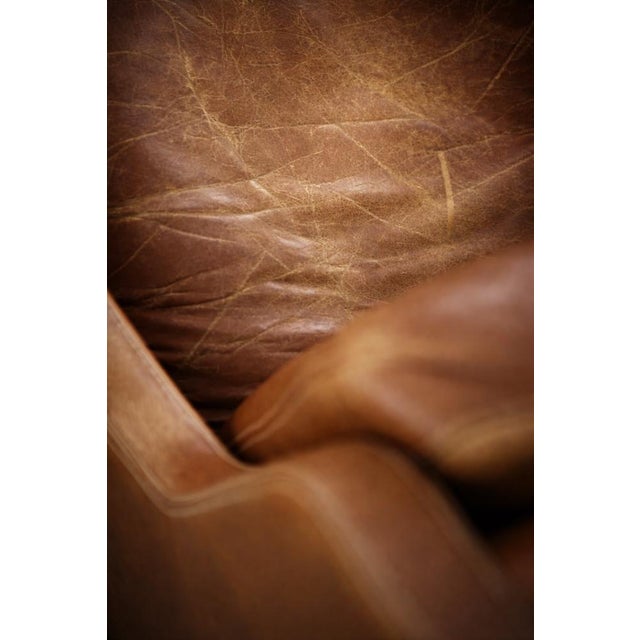 This rare model 39 armchair was designed by Kai Lyngfeldt Larsen for the Danish manufacturer Søren Willadsen during the...