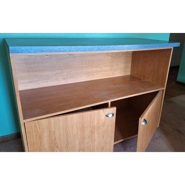 It will hold everything! Large storage cabinet with open shelving and closed cabinets too. Could use as a dry bar if you...