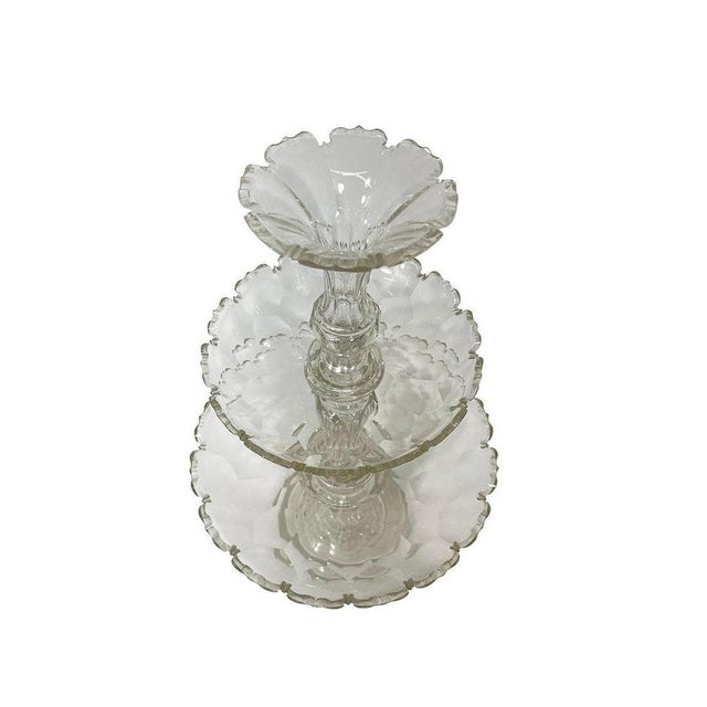 A beautiful centerpiece made of crystal with cut scalloped edges. The large piece, 54 cm high, consists of four parts: the...