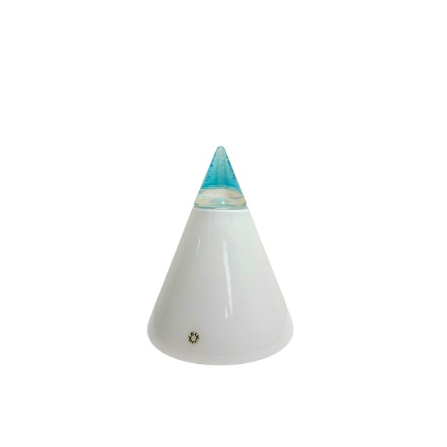 An Italian table lamp designed by Giusto Toso for Leucos, circa 1975. The lamp has a conical design and is made of white...