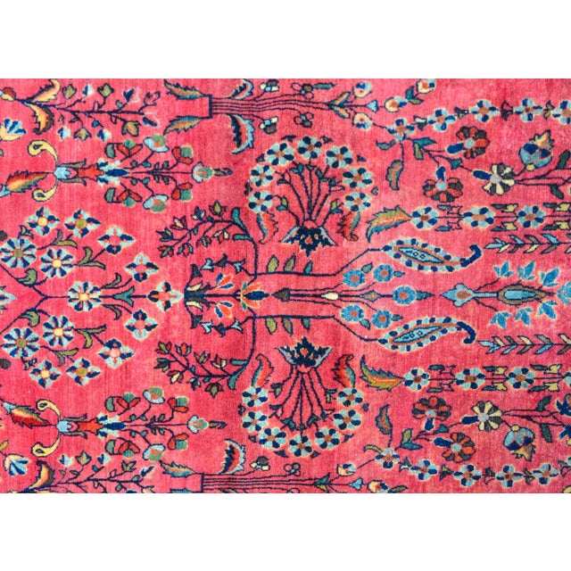 A wonderful early 20th century Persian Sarouk Mohajeran rug with a traditional mirrored tree-of-life pattern woven in...