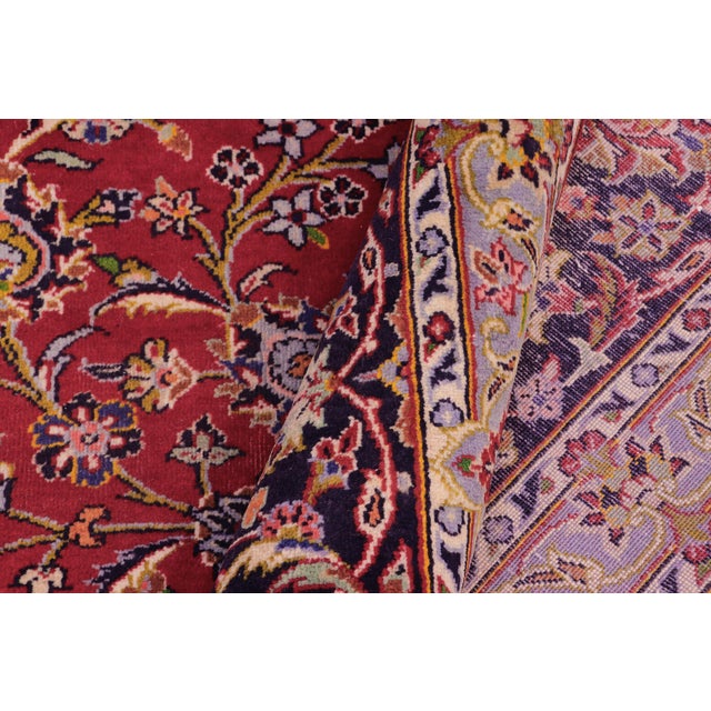 Elevate your home with this magnificent, hand-knotted Oriental rug. This grand-sized carpet features a highly detailed...