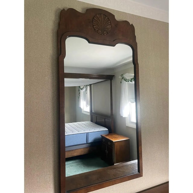 Offered is a rare solid wall wood mirror by Baker Furniture. The coordinating bedroom furniture pieces have sold.