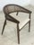 For sale is a stylish armchair made of elegant dark wood, featuring a semi-circular backrest with classic wickerwork and a...