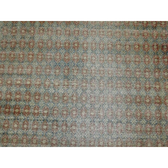 Late 19th century Persian Tabriz room size carpet. A spiraling all-over rust/terracotta colored diamond pattern on a soft...