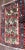 A charming antique Persian Bakhtiari rug featuring an ivory field filled with an all-over floral pattern of stylized...