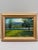 A serene original landscape painting by Gary Dagnan depicting a calm lakeside scene framed by sunlit trees and distant...