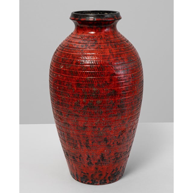 This 20th-century German ceramic vase, stamped W. Germany, embodies the bold aesthetic of mid-century West German...