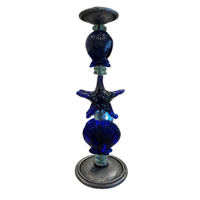 This pair of cobalt blue candlesticks, characterized by artistic impression and imagination will create a dynamic and...