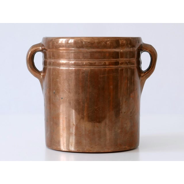 Extremely rare, elegant and highly decorative mid century modern solid bronze champagne cooler or ice bucket. Designed by...