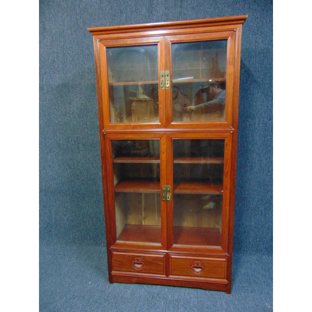 Chinese style bookcase, made of mahogany, 4 doors with 2 drawers below, carved Asian design drawer pulls, brass hardware,...