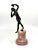 A nicely done grand tour neoclassical souvenir of a dancing maiden mounted to a stunning rouge marble base. A lovely...