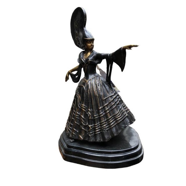 A gorgeous ballroom dancer bronze statue, signed, 20th century. The artist has excellent attention to detail, with a...