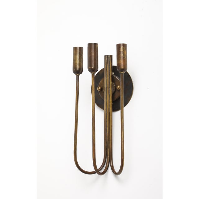 A brass 3-socket wall light designed and produced in Italy, c. 1940s. Wired for USA and UL listed. Back Plate Diameter: 5"...