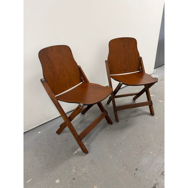 These chairs are in EXCELLENT condition and are ready to use. Both have the American Seating Company stamp on the bottom....
