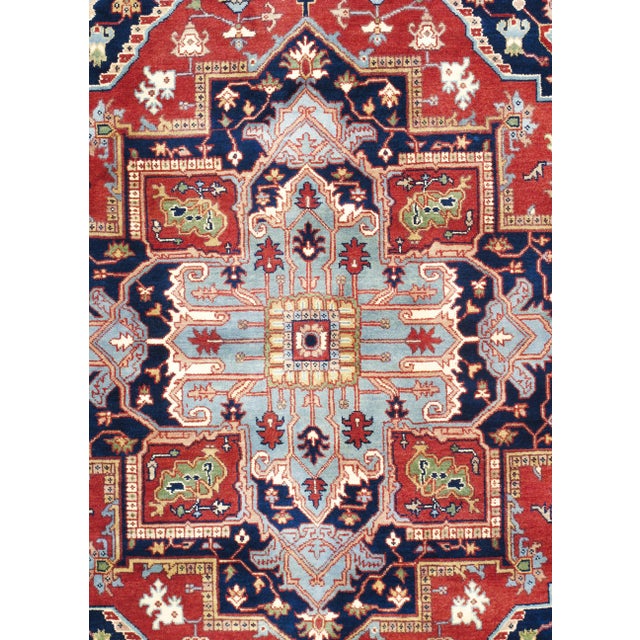 The Serapi Collection reinterprets traditional tribal geometric design through a refined palette. Each rug is hand-knotted...